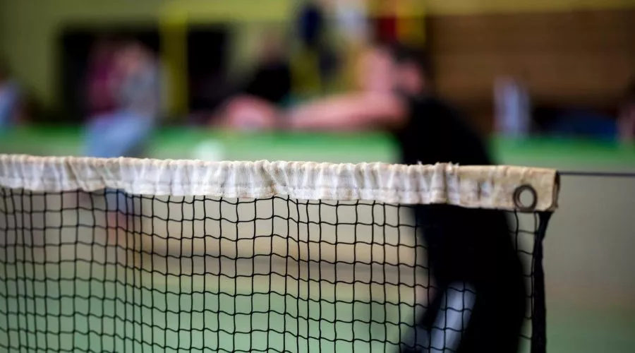 How tall is a badminton net for doubles games?