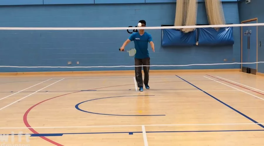 How tall is a badminton net for singles games?